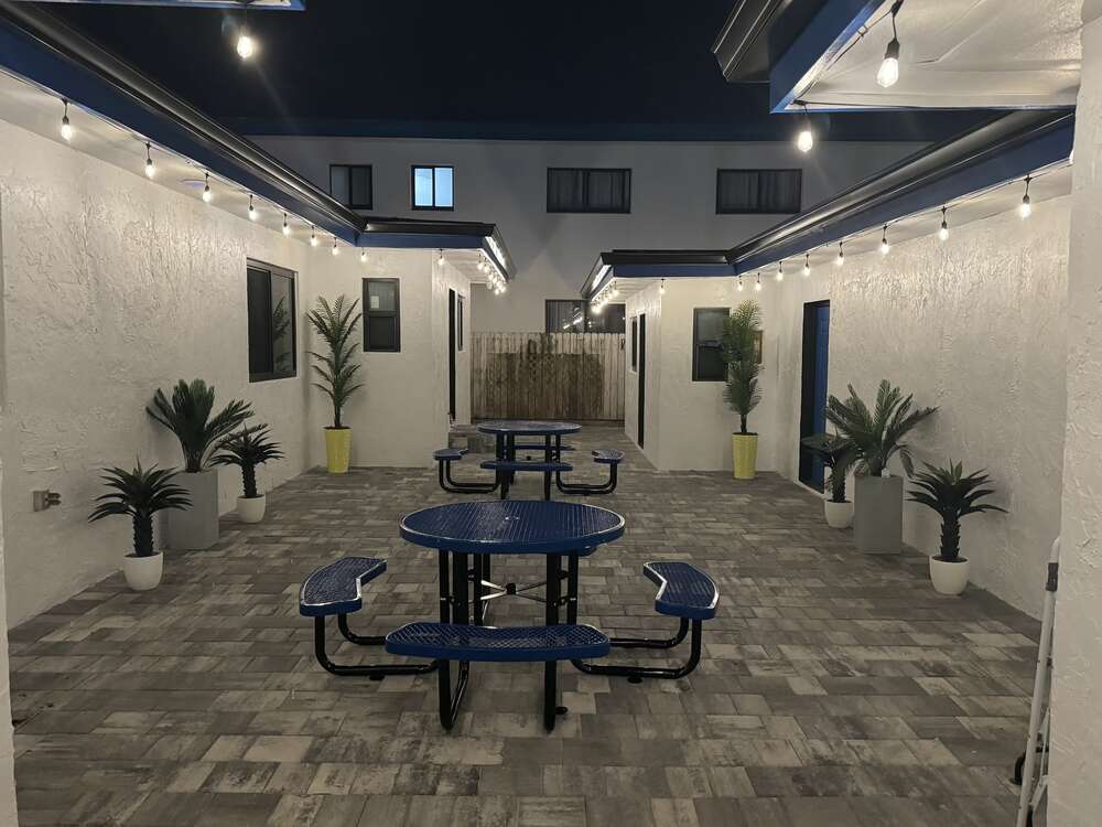 Courtyard at dusk with string lights
