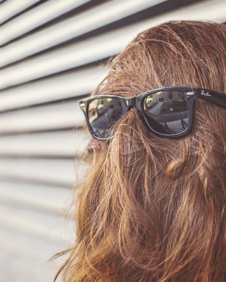 A chewbacca with sunglasses on and long hair.