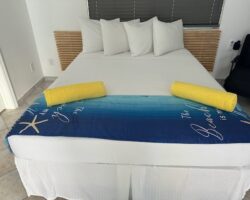 A bed with pillows and blankets on it