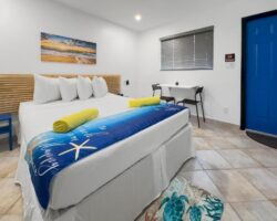 Bright, cozy bedroom with a modern design and colorful accents.